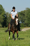 Frau reitet Deutsches Reitpony / woman rides pony