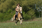 Frau reitet Haflinger / woman rides haflinger horse